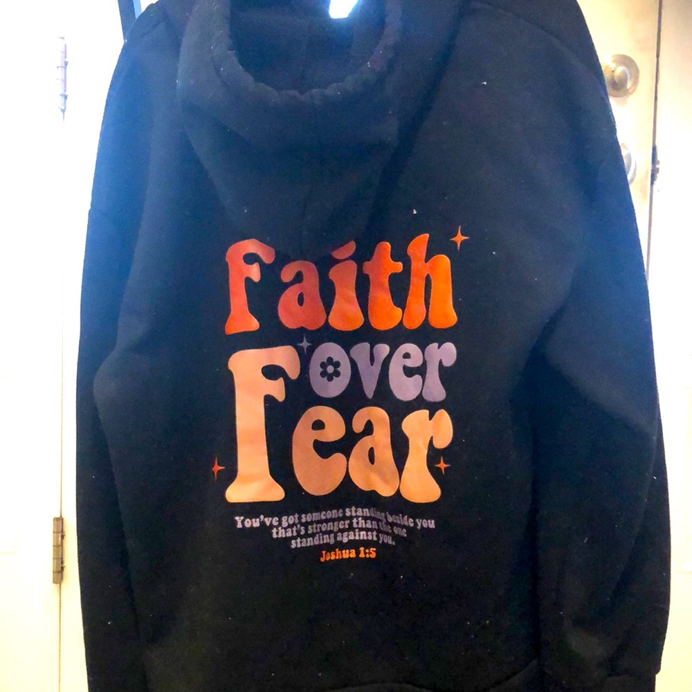 Black hoodie with biblical saying